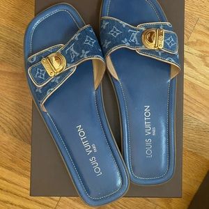 Louis Vuitton denim slides.